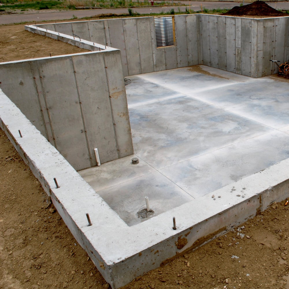 Steel reinforced concrete basement with finished walls and floors