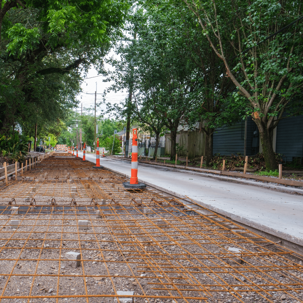 Concrete sidewalk construction with steel reinforcement